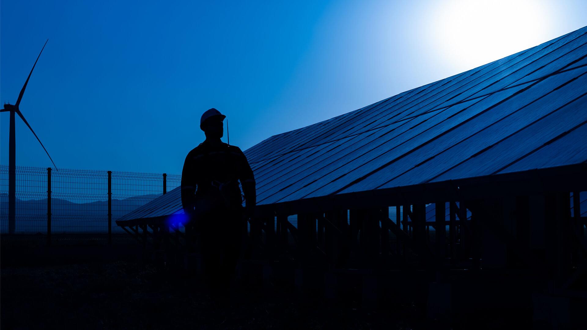 A beautiful landscape with solar panels under a clear blue sky.